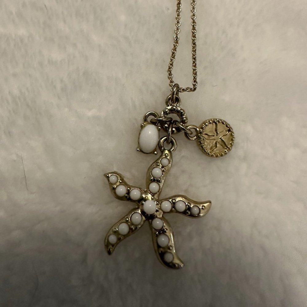 Costume gold tone with starfish charm necklace.